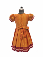 Girls mustard yellow traditional Khun frock with lotus peacock brocade yoke - House of Kritee