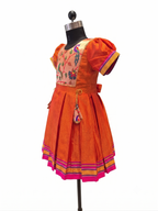 Bright orange Khun knee length frock with embroidered parrot peacock front yoke - House of Kritee