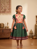 Dark green traditional Khun knee length frock with peach embroidered silk yoke - House of Kritee
