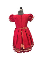Red traditional Khun knee length frock for girls with peach lotus brocade front yoke - Houser of Kritee