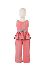Red patterned outfit with a peplum top and wide-leg pants on a mannequin against a white background