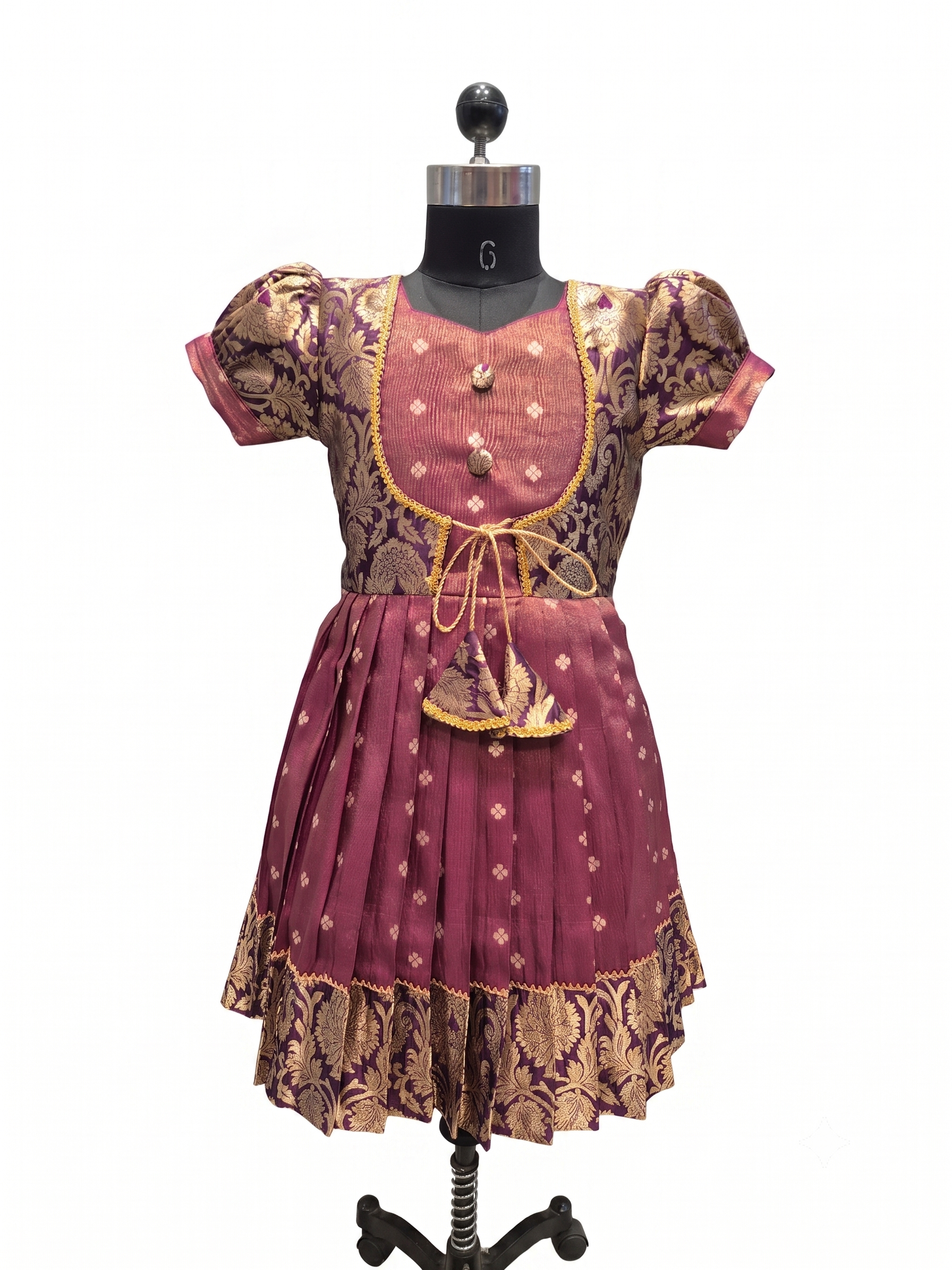 A traditional Indian outfit consisting of a maroon and gold patterned kurta and matching skirt, displayed on a black mannequin against a white background. - House of Kritee