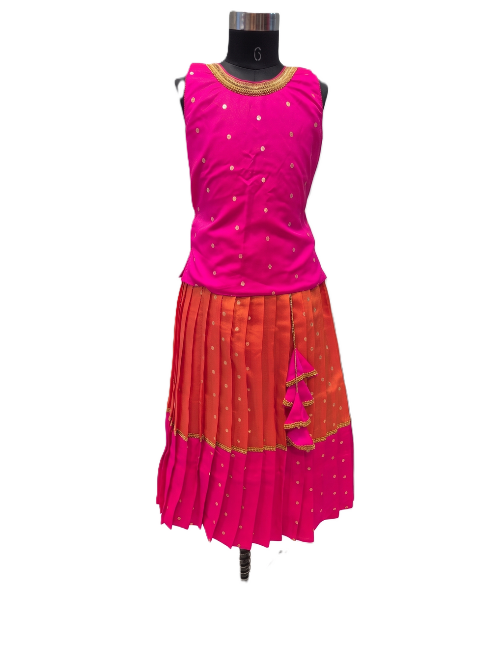 A sleeveless traditional-style outfit displayed on a black mannequin torso against a plain white background. The top is bright pink with small metallic gold dot embellishments and a gold-trimmed neckline. - House of Kritee