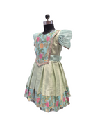 A traditional Filipino dress displayed on a black mannequin torso against a solid white background. The dress features a light sage green skirt, a light blue bodice with puff sleeves, and a floral embroidered yoke with pink, orange, and green details. - House of Kritee