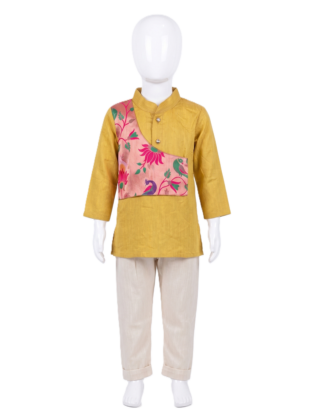 A children's traditional outfit displayed on a white mannequin, featuring a mustard yellow kurta with a pink floral and peacock patterned yoke panel, paired with light beige trousers. - House of Kritee