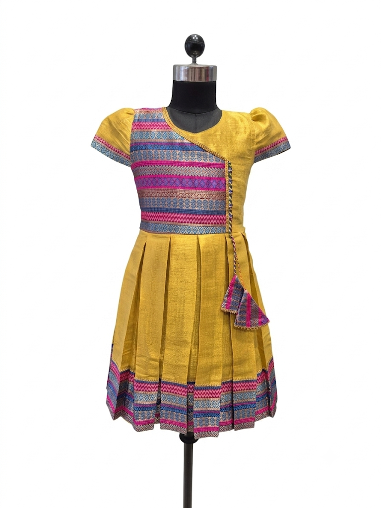 Happy Desi girl model wearing a yellow silk Angrakha knee length ethnic frock with geometric border - House of Kritee