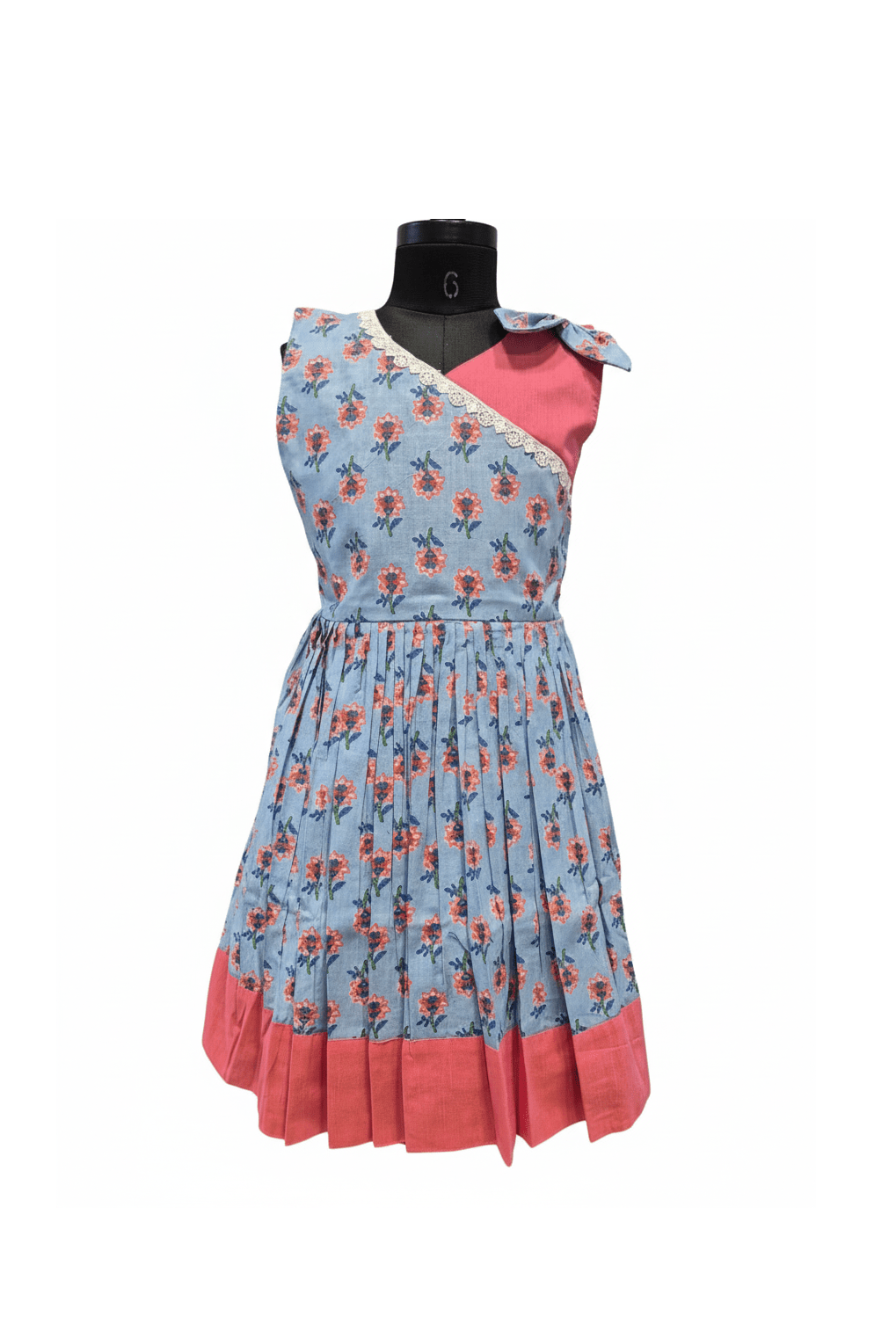Mannequin wearing a dress with floral pattern and pink accents on a white background - House of Kritee