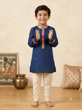 Boy wearing royal blue printed kurta pajama ethnic set 