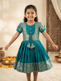 Little girl wearing teal ethnic silk frock with traditional floral jacket"
