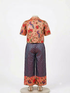 Girls' purple crop top, pants, and peacock print Paithani jacket festive outfit