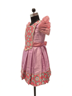 Happy Desi girl model wearing a soft lilac pink silk knee length frock with organza puff sleeves - House of Kritee