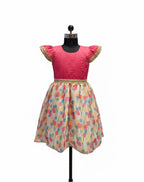 Young Indian girl model wearing pink silk and multi color floral print knee length festive dress - House of Kritee