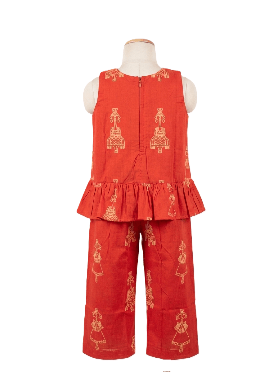 Red outfit with gold embroidery on a mannequin against a white background
