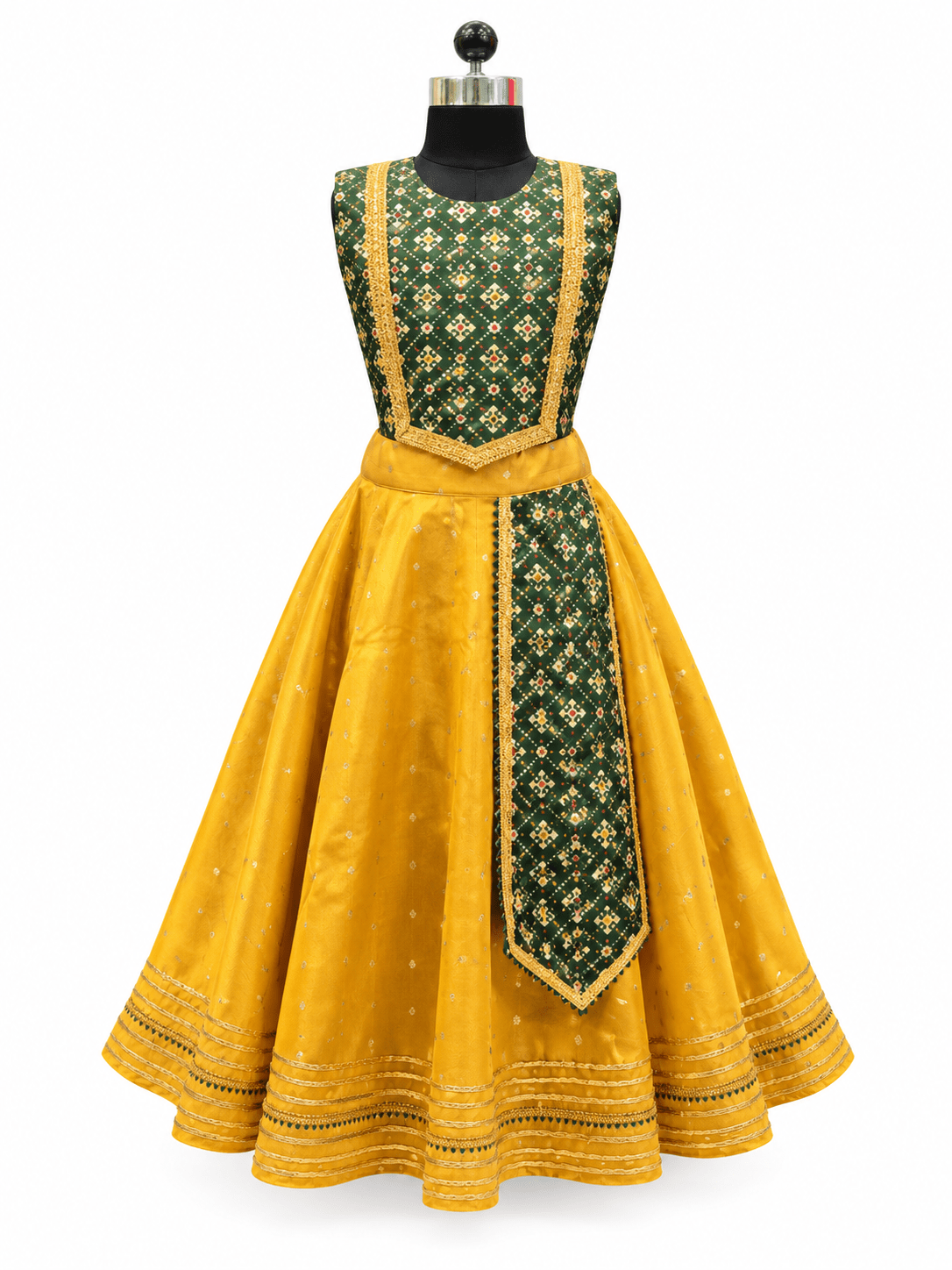 Young Indian girl model wearing traditional yellow and dark green parkar polka lehenga dress set with gold lace border
