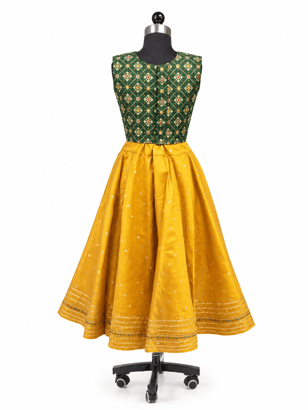 Young Indian girl model wearing traditional yellow and dark green parkar polka lehenga dress set with gold lace border