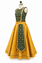 Young Indian girl model wearing traditional yellow and dark green parkar polka lehenga dress set with gold lace border