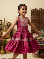 Happy young girl wearing premium silk knee-length ethnic frock dress smiling in a warm cream cream-colored room