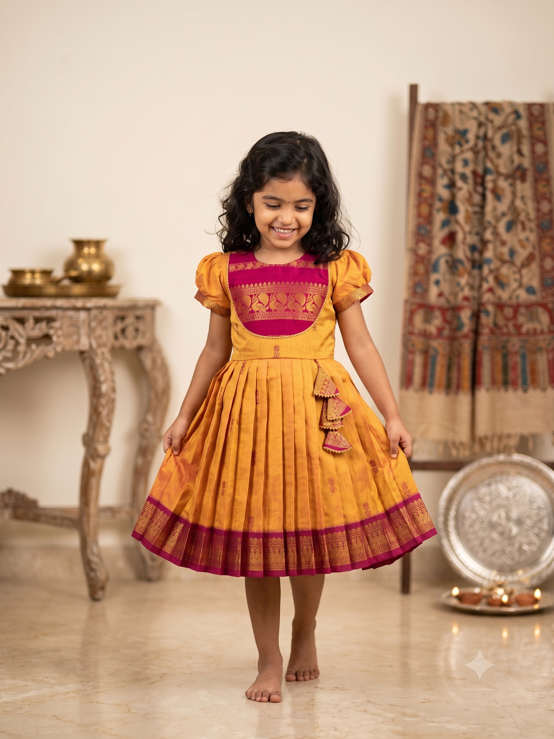 Happy young girl wearing a traditional mustard yellow and magenta silk knee-length frock in a premium warm cream background
