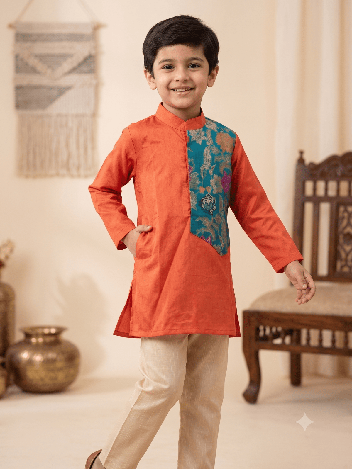 Boys traditional orange silk kurta pyjama set with teal brocade panel - House of Kritee