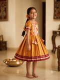 Girls mustard yellow traditional Khun frock with lotus peacock brocade yoke - House of Kritee