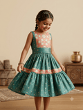 A beautiful teal-green silk tiered frock for girls, with a richly embroidered yoke and hem border
